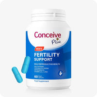 Conceive Plus Men's Fertility Support + Lubricant product image showing 60-capsule blue-labeled Men's Fertility Support supplement bottle with two blue capsules displayed in front, set against a white background to highlight male reproductive health and sperm support formula.