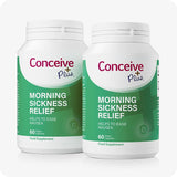 Two bottles of Conceive Plus Morning Sickness Relief supplements, each labeled with 60 vegan capsules. Green and white packaging highlights its purpose to ease nausea during pregnancy.