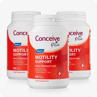 Triple pack of Conceive Plus Motility Support bottles, each containing 60 vegan capsules. Red and white label highlights its benefits as a male fertility aid, designed to improve sperm motility and count with CoQ10, Vitamin D, and Zinc.