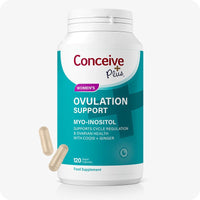 Conceive Plus Ovulation Pack - Fertility + Ovulation Supplements featuring the Ovulation Support bottle with a teal label, 120 vegan capsules, and two beige capsules shown beside the bottle on a white background.
