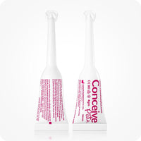Conceive Plus Women's Fertility Support + Applicators featuring front and back views of two 4g pre-filled vaginal lubricant applicators with pink text on white tubes, shown upright on a white background to display usage instructions, branding, and dosage clarity for female fertility care.